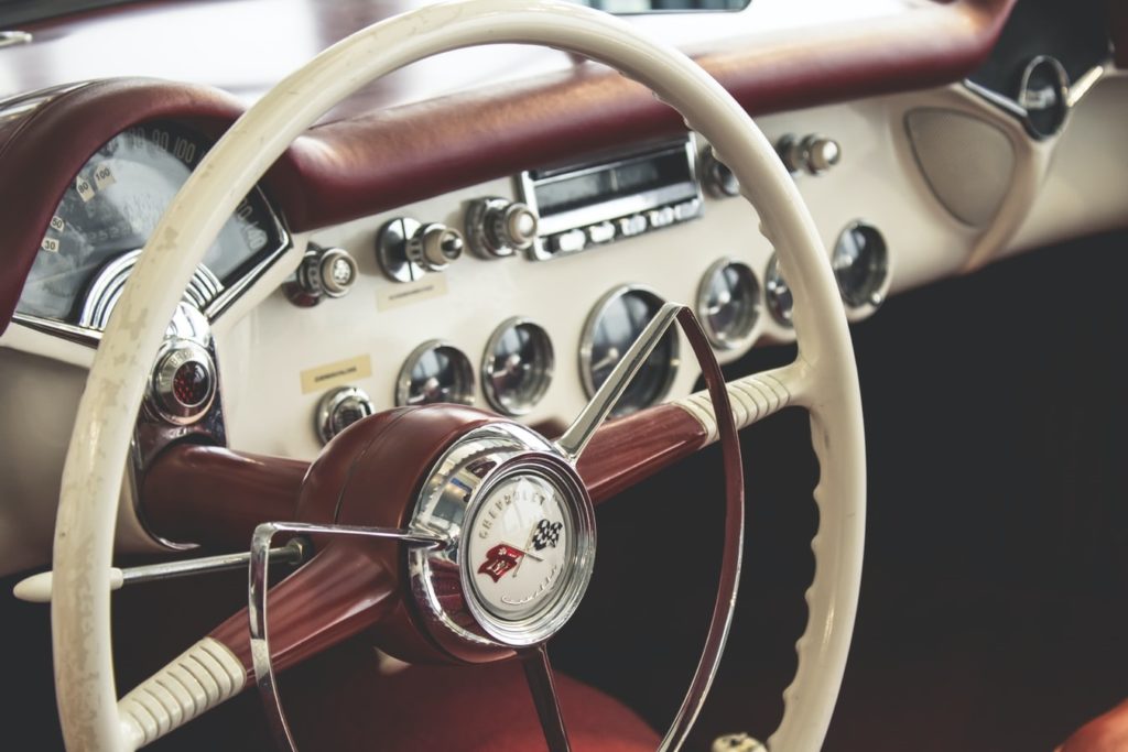 Close up of a newly detailed car dashboard and steering wheel