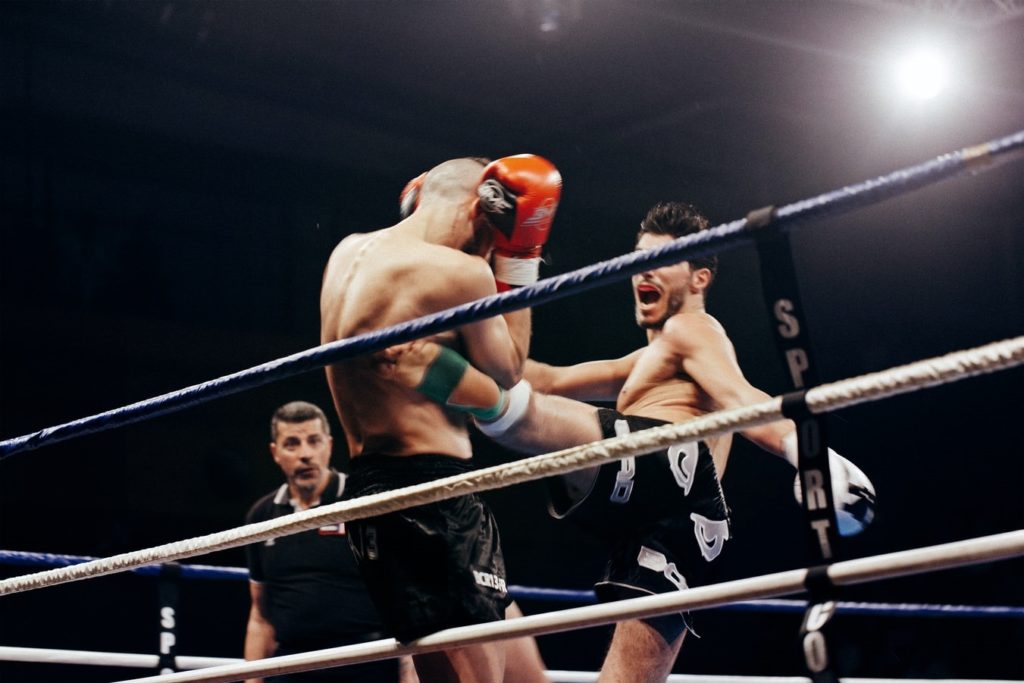 Kickboxers fighting in a ring