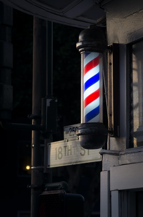 Barber shop pole on street corner
