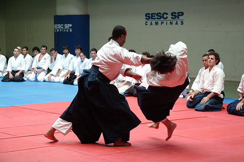 Aikido instructor demonstrating moves in front of class