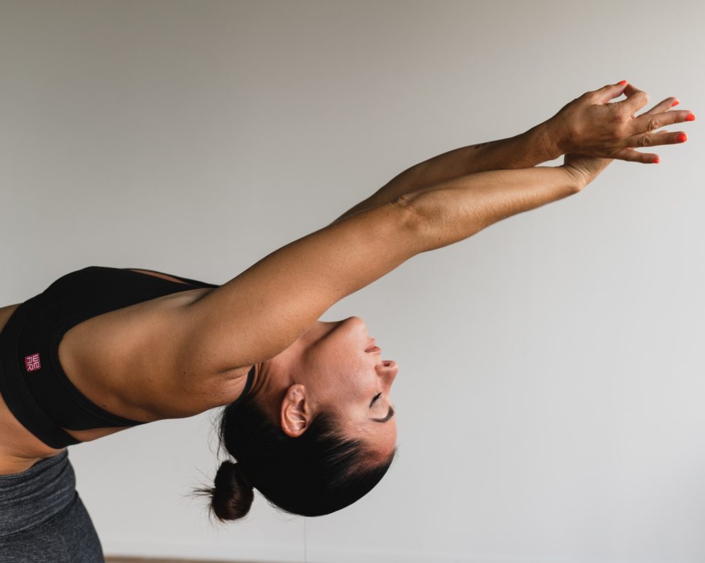 Yoga instructor demonstrating a back bend