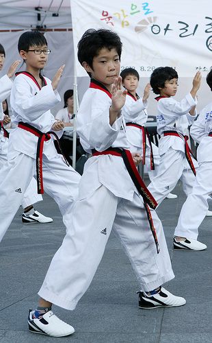 Taekwondo students training in a class