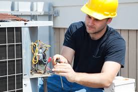 HVAC contractor repairing an air conditioning unit