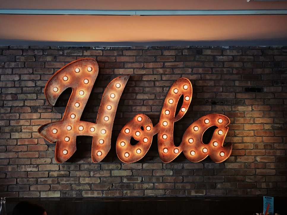 Decorative sign which reads "Hola"