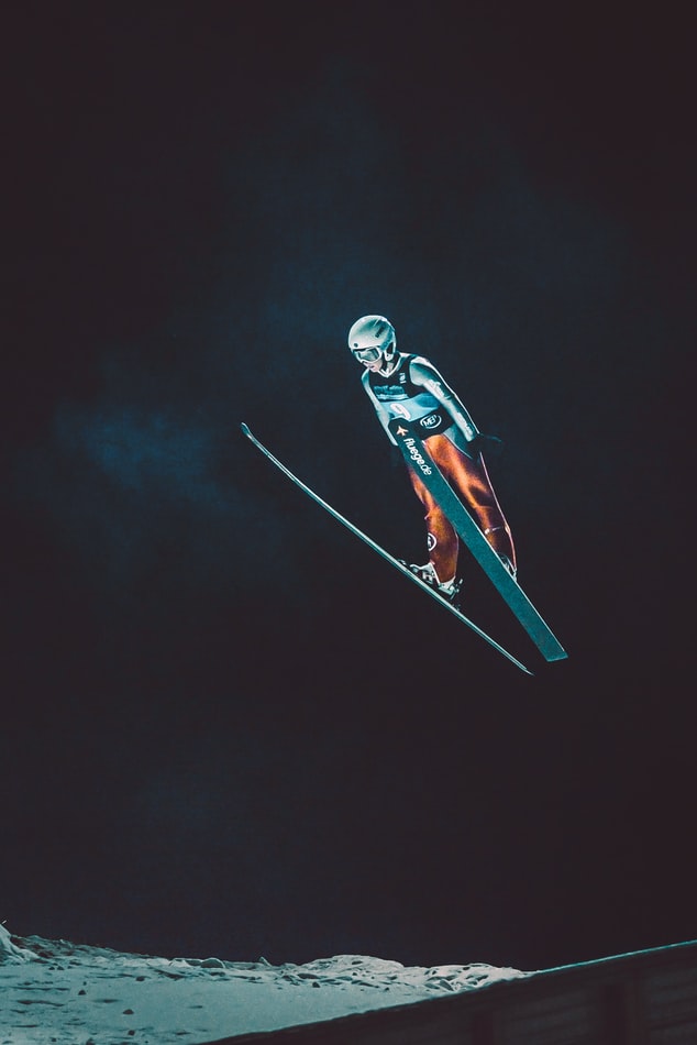 Skier soaring through the night sky