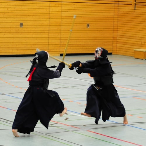 Kendo fighter battling with Shinai sticks