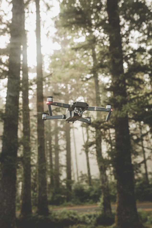 Drone flying through the woods