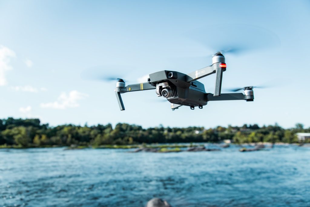 Close up of drone flying over a body of water